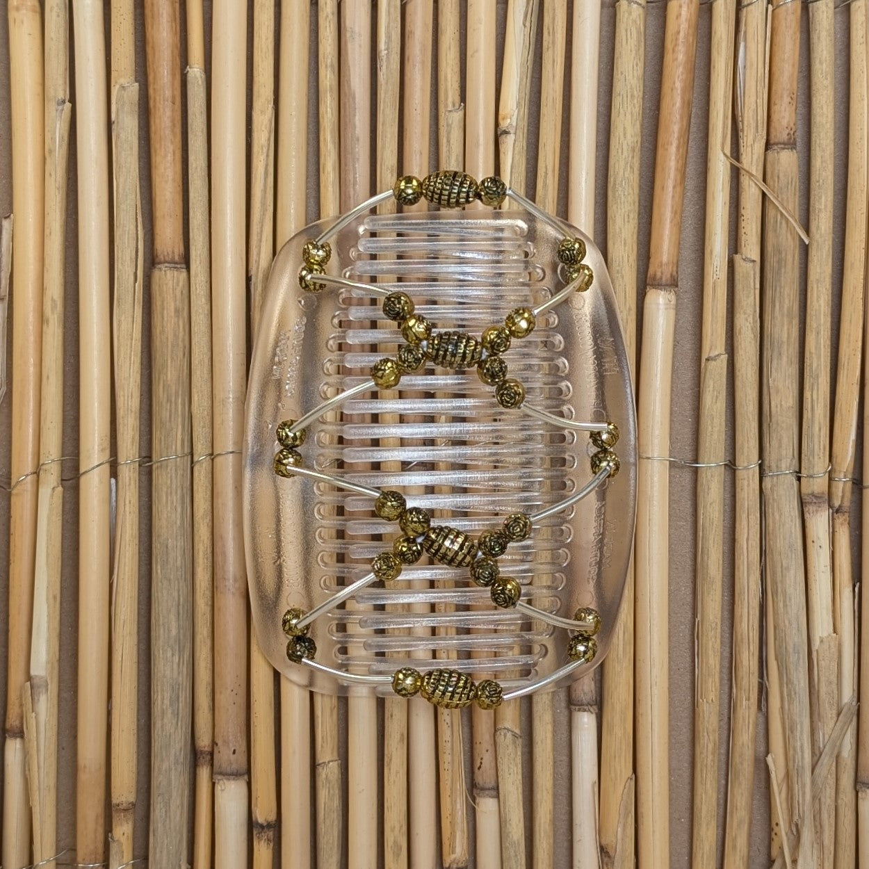African Butterfly "Beada Tube" mit goldenen Kunstperlen durchsichtig