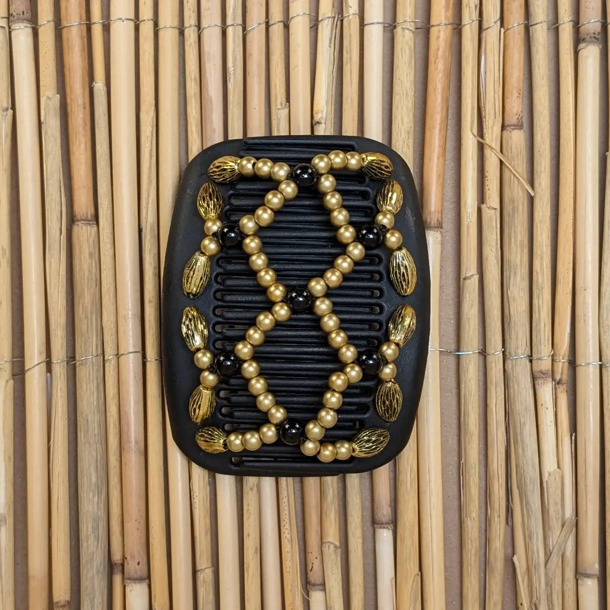 African Butterfly "Ndalena" mit goldenen-schwarzen Kunstperlen schwarz