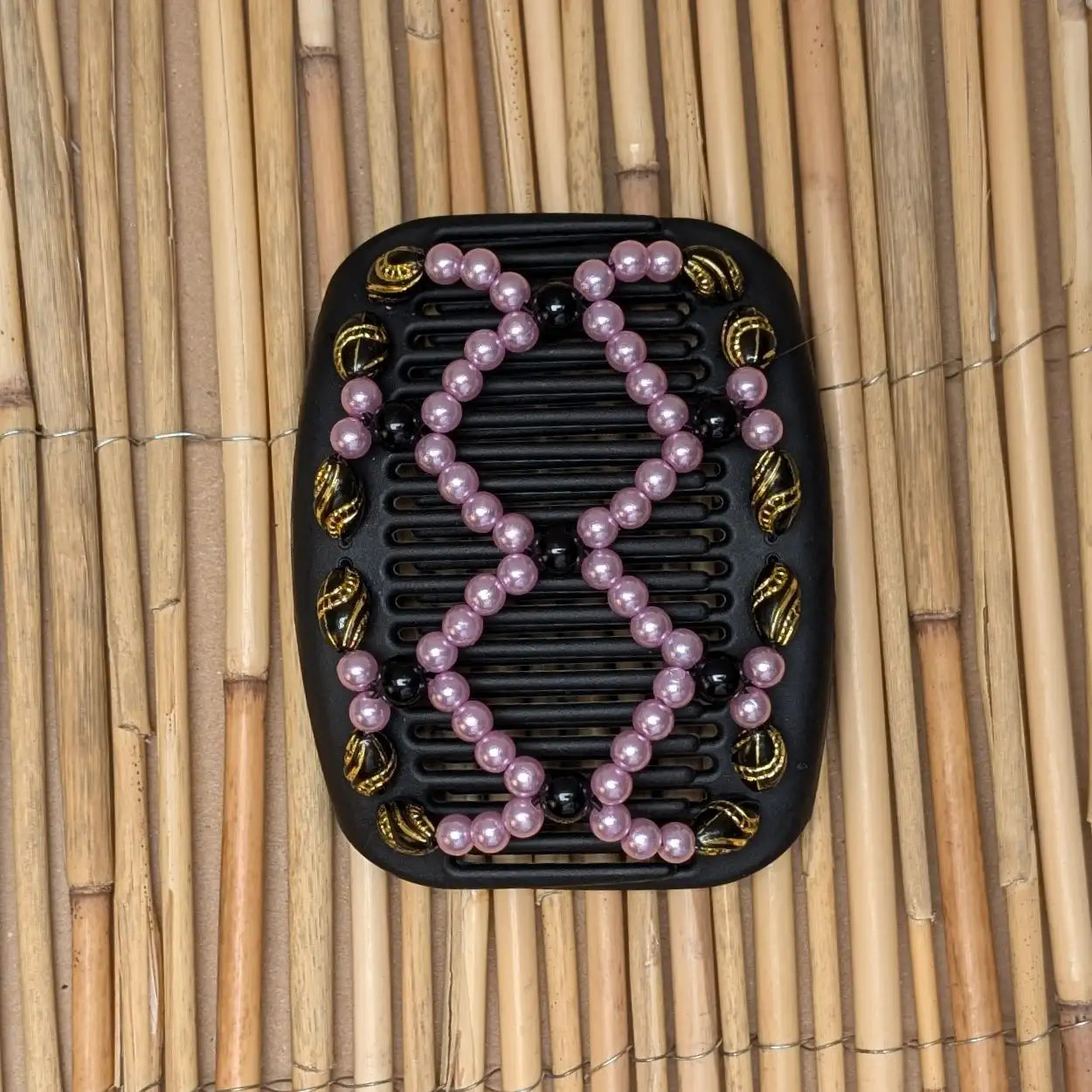 African Butterfly schwarzer Kamm mit rosa schwarzen Kunstperlen