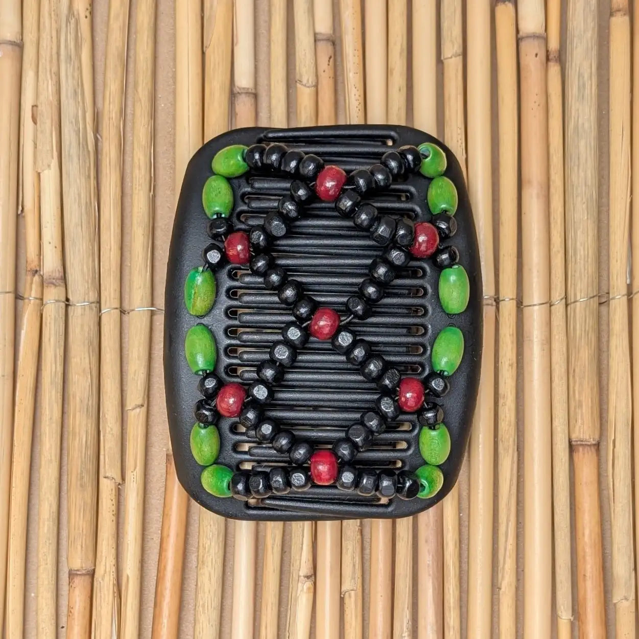 African Butterfly schwarzer Kamm mit grün rot schwarzen Holzperlen