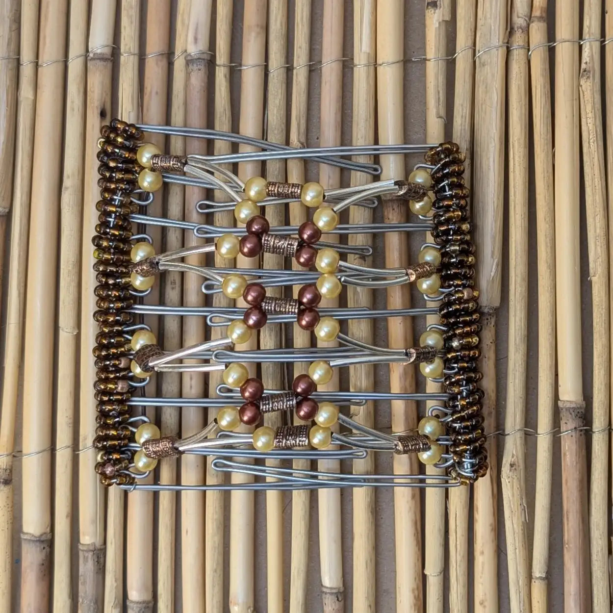 Rhino "Ndalena" groß mit gold-braunen Kunstperlen