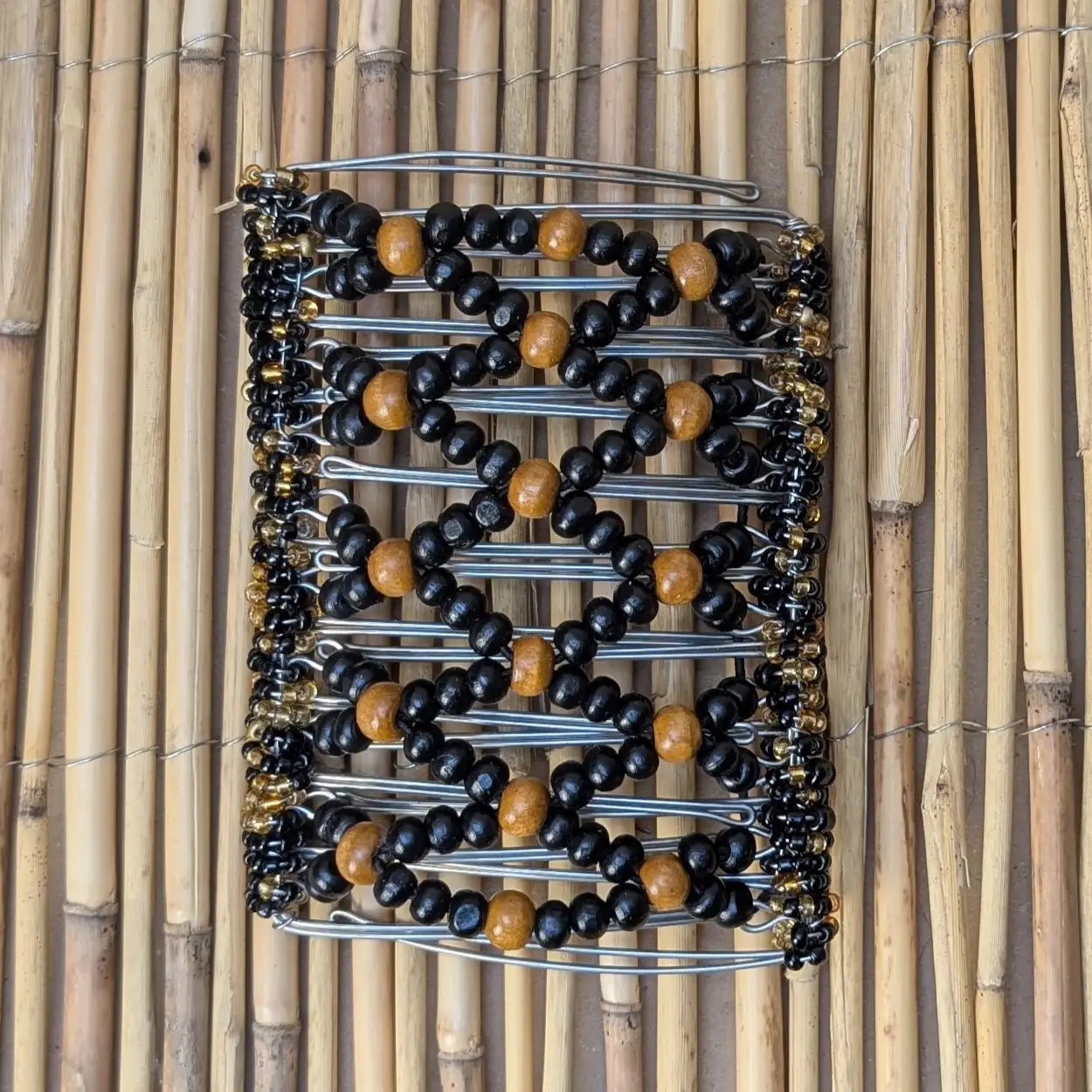 Rhino "Ndbele" extragroß mit schwarz-braunen Holzperlen