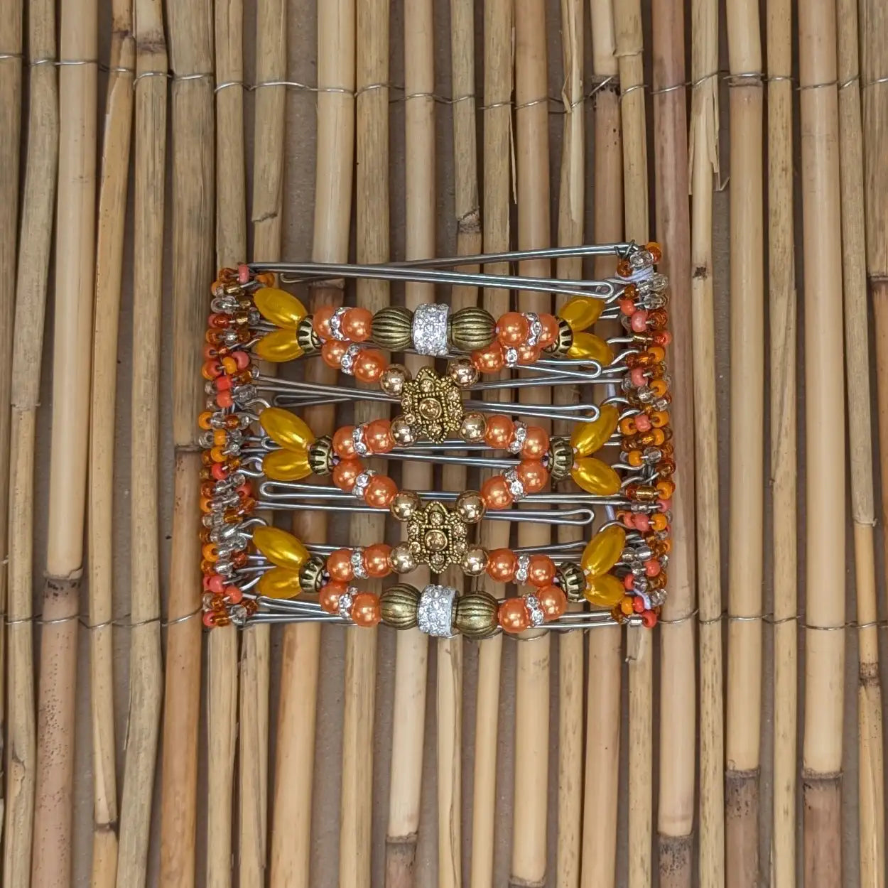 African Butterfly Drahtkamm Rhino Deluxe mit orangen Kunstperlen und 7 Zähnen 