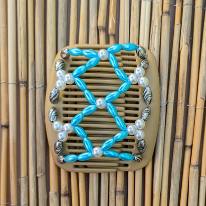 African Butterfly "Ndalena" mit türkis-silbernen Kunstperlen durchsichtig