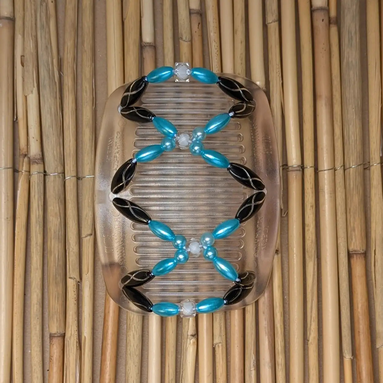 African Butterfly "Dalena" mit schwarz-türkisen Kunstperlen durchsichtig