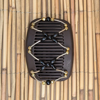 African Butterfly "Beada Tube" mit gold-schwarzen Kunstperlen braun