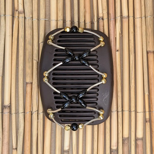 African Butterfly "Beada Tube" mit gold-schwarzen Kunstperlen braun