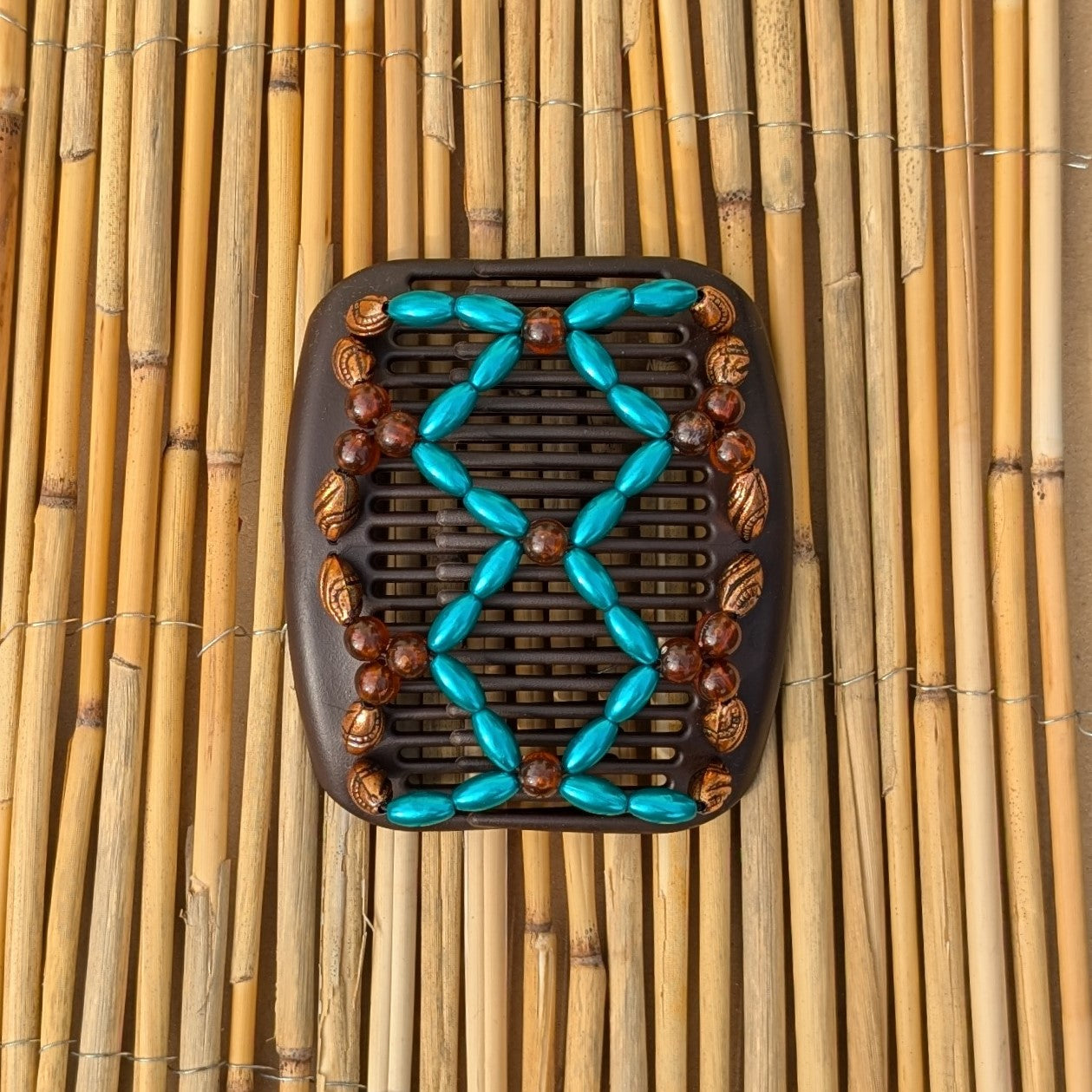 African Butterfly "Ndalena" mit bronze-blautürkise Kunstperlen braun