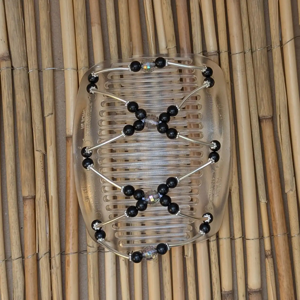 African Butterfly "Beada Tube" mit schwarzen Kunstperlen durchsichtig