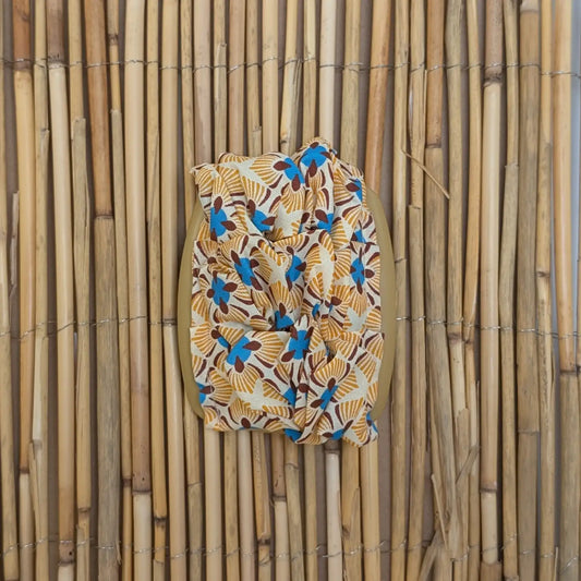 African Butterfly "Stoff" mit blau-orangenen Stoff beige