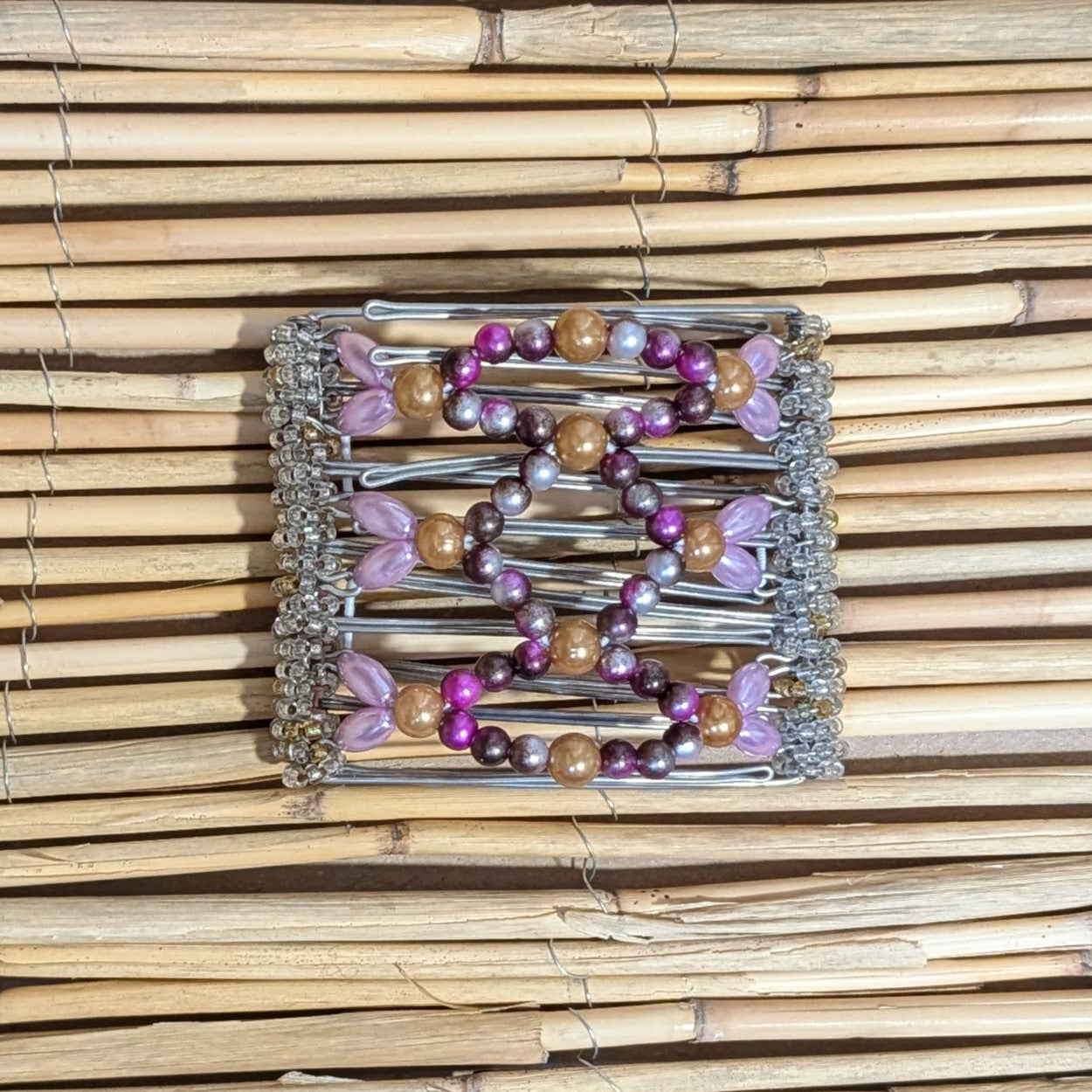 Rhino "Ndalena" mittel mit pinken Kunstperlen