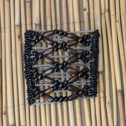 Rhino "Ndbele" groß mit dunkelbraun-schwarzen Holzperlen