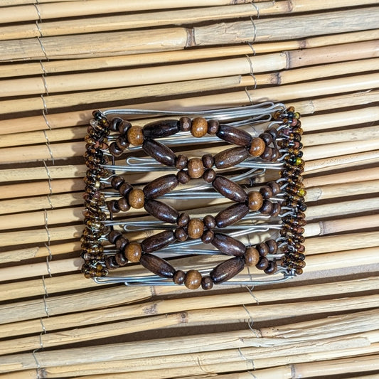 Rhino "Ndbele" mittel mit braunen Holzperlen