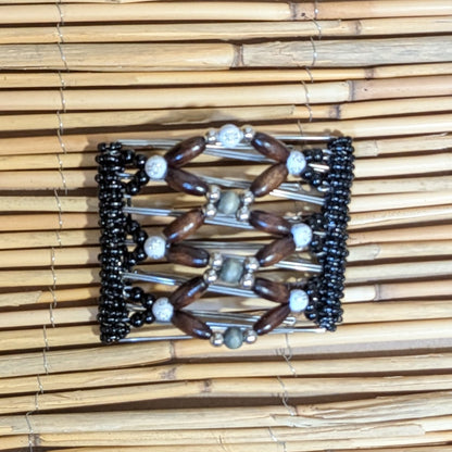 Rhino "Ndbele" mittel mit schwarz-braunen Holzperlen